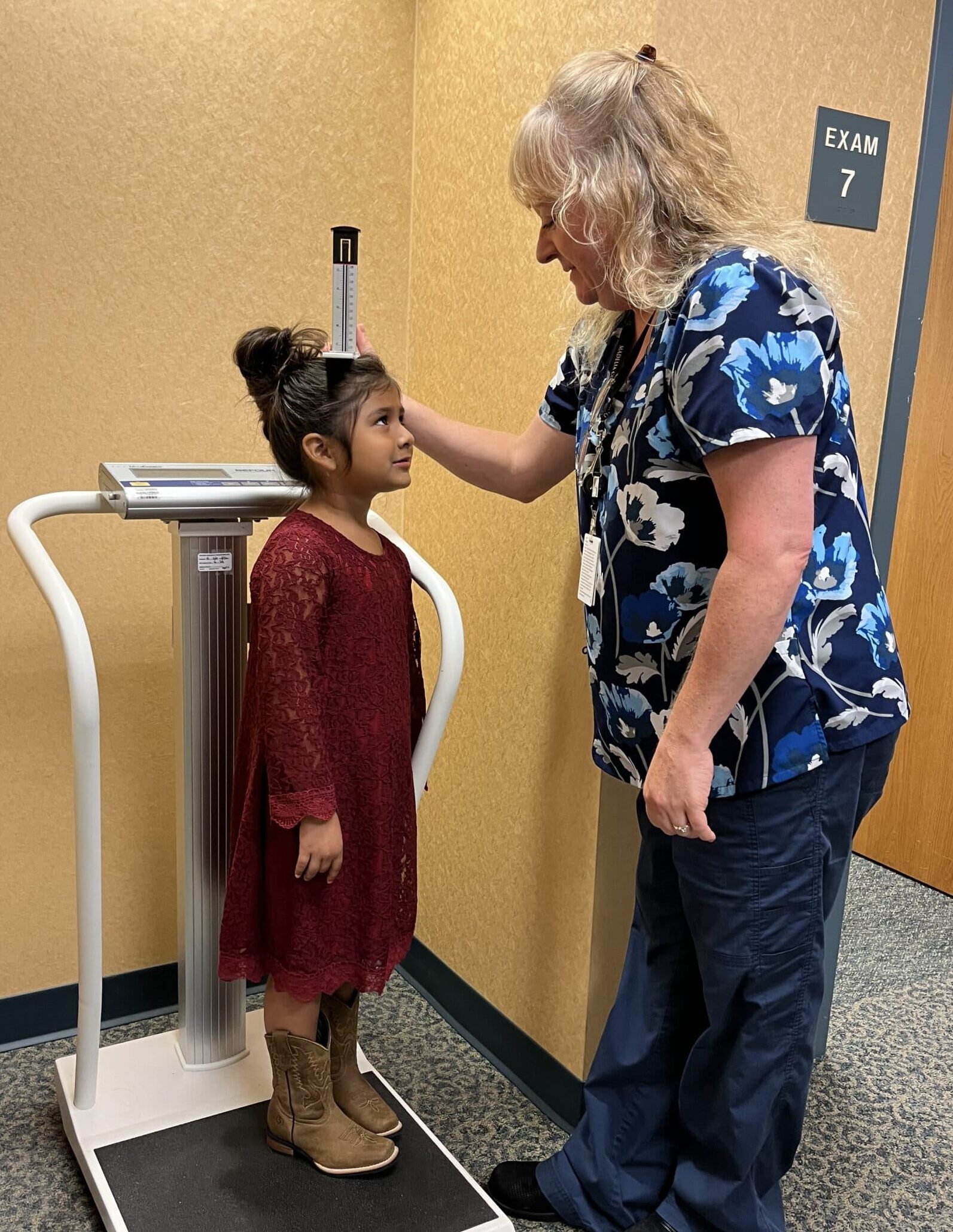 Melissa getting a height Nurse taking a height for a patient